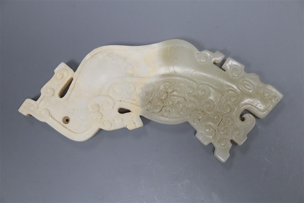 A Chinese archaistic pale celadon and calcified jade plaque